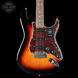 Fender electric guitar with a sunburst finish on a black background