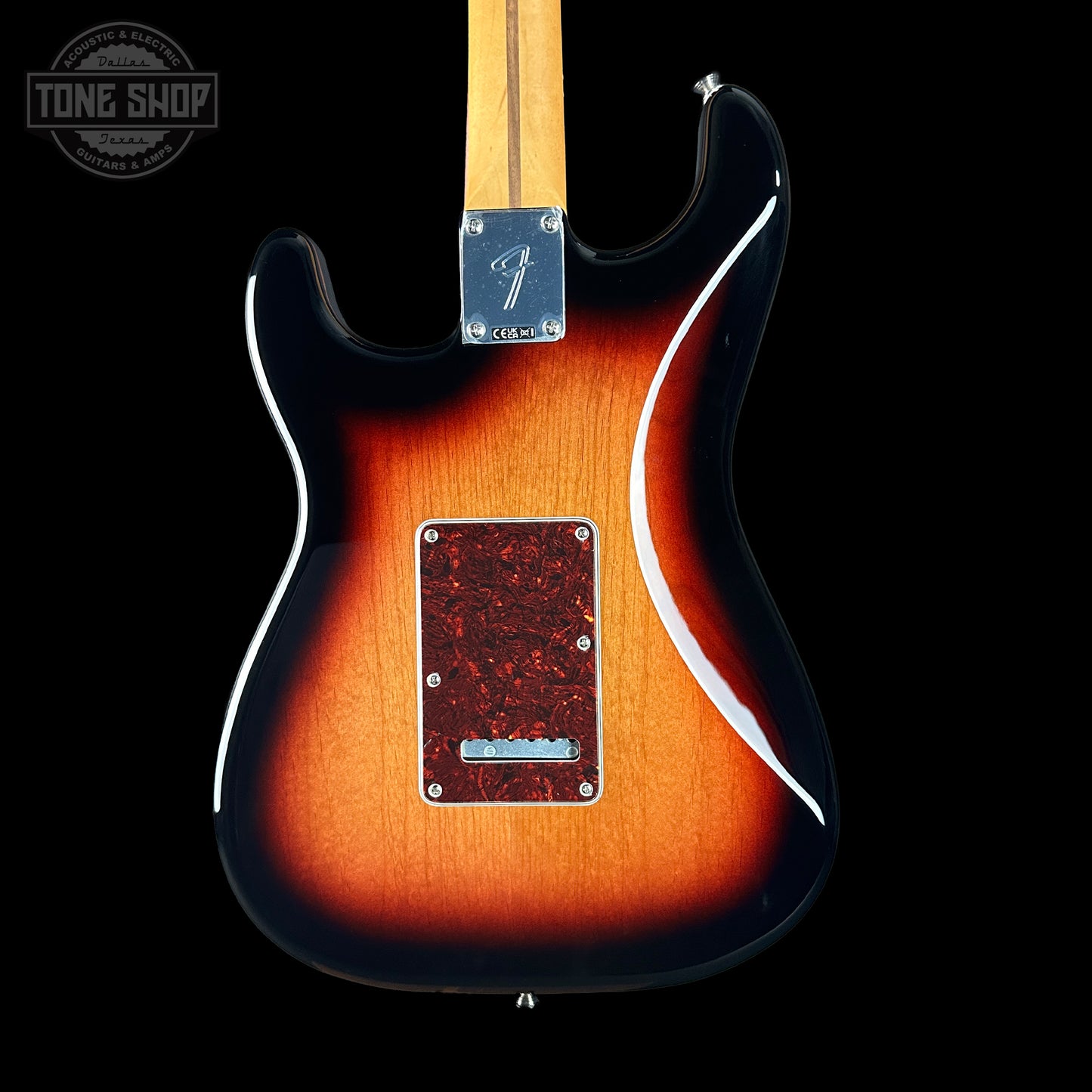 Electric guitar with a sunburst finish on a black background, featuring the Tone Shop logo.