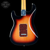 Electric guitar with a sunburst finish on a black background, featuring the Tone Shop logo.