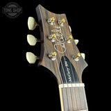 Headstock of PRS Wood Library McCarty 594 10-top Quilt Black Gold Wraparound Korina.