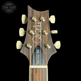 Headstock of PRS Wood Library McCarty 594 10-top Quilt Black Gold Wraparound Korina.