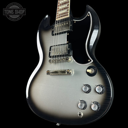 Silver electric guitar with a black background, featuring the 'Tone Shop' logo.