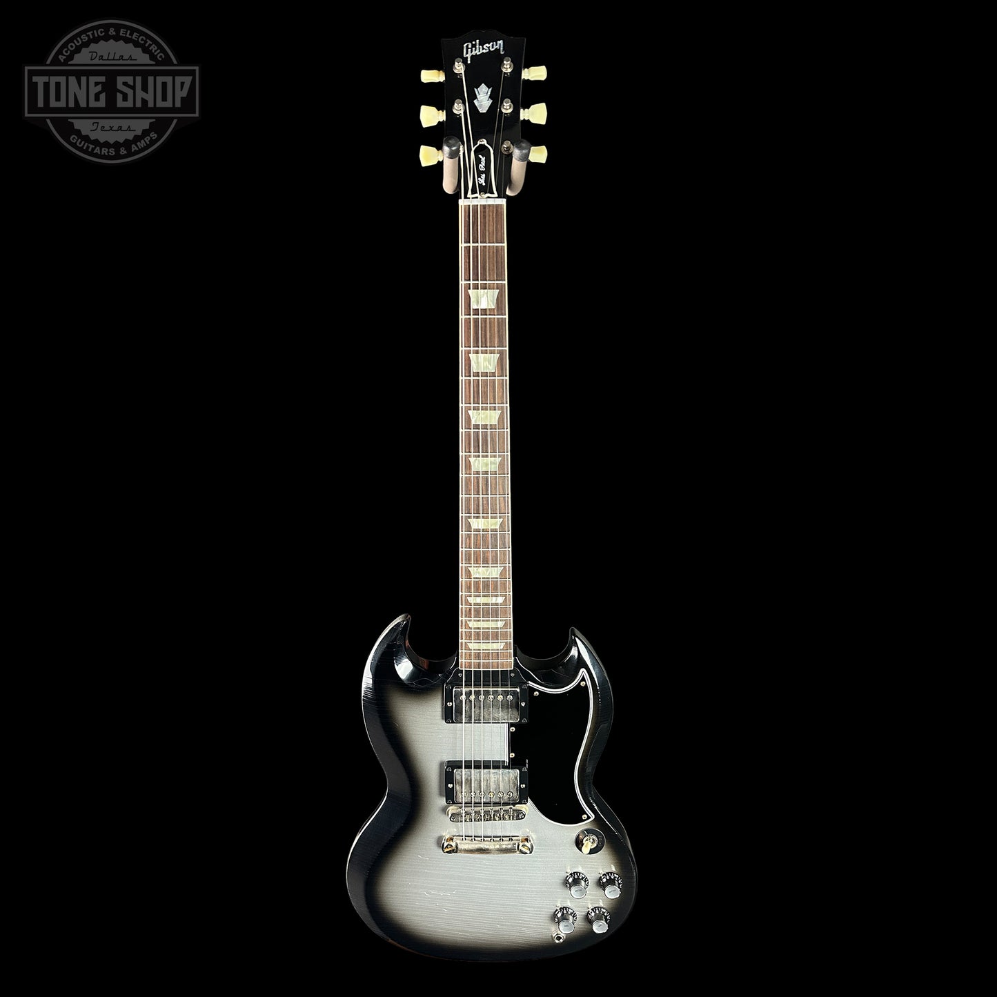 Gibson electric guitar on a black background with 'Tone Shop' logo.