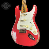 Front angle of Fender Custom Shop Time Machine '57 Strat Heavy Relic Aged Fiesta Red.