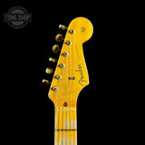 Front of headstock of Fender Custom Shop Time Machine '57 Strat Heavy Relic Aged Fiesta Red.