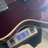 Used 1997 Guild Starfire II TRP Mahogany Trans Red w/SD Pickups on scale displaying weight.