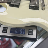 Used 2009 Epiphone SG White on scale displaying weight.