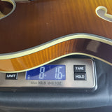 Used 2021 Eastman Guitars T486-GB Thinline Semi-hollowbody Gold Burst on scale displaying weight.