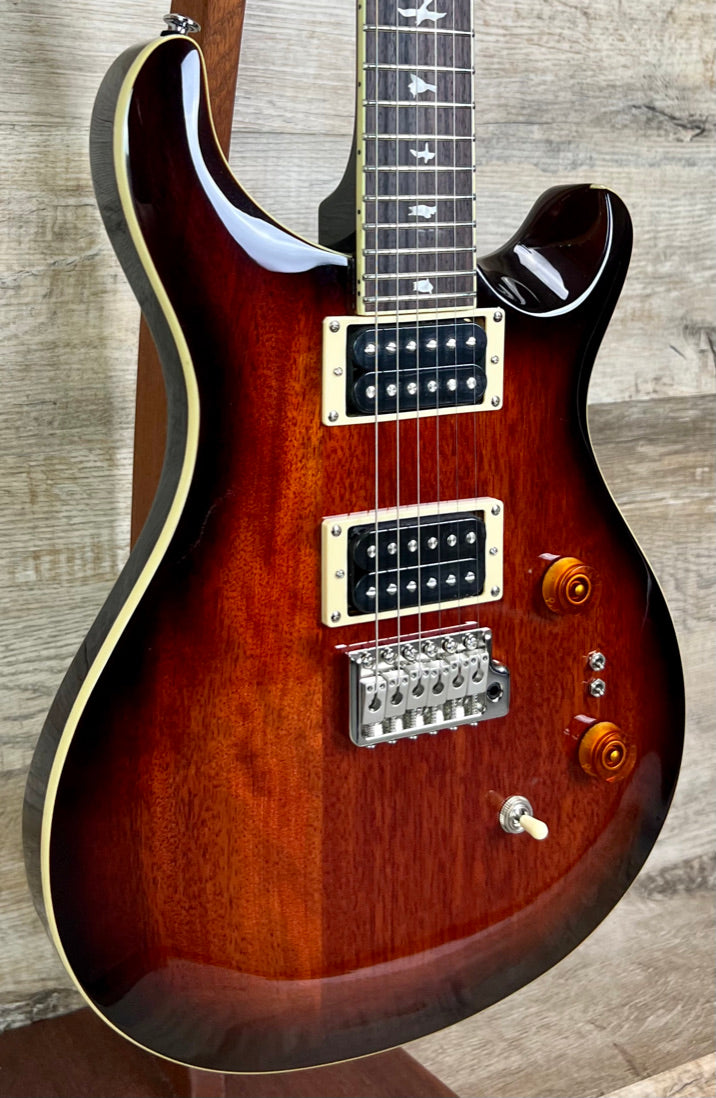 Front left angle of PRS Paul Reed Smith SE Standard 24-08 Tobacco Sunburst.