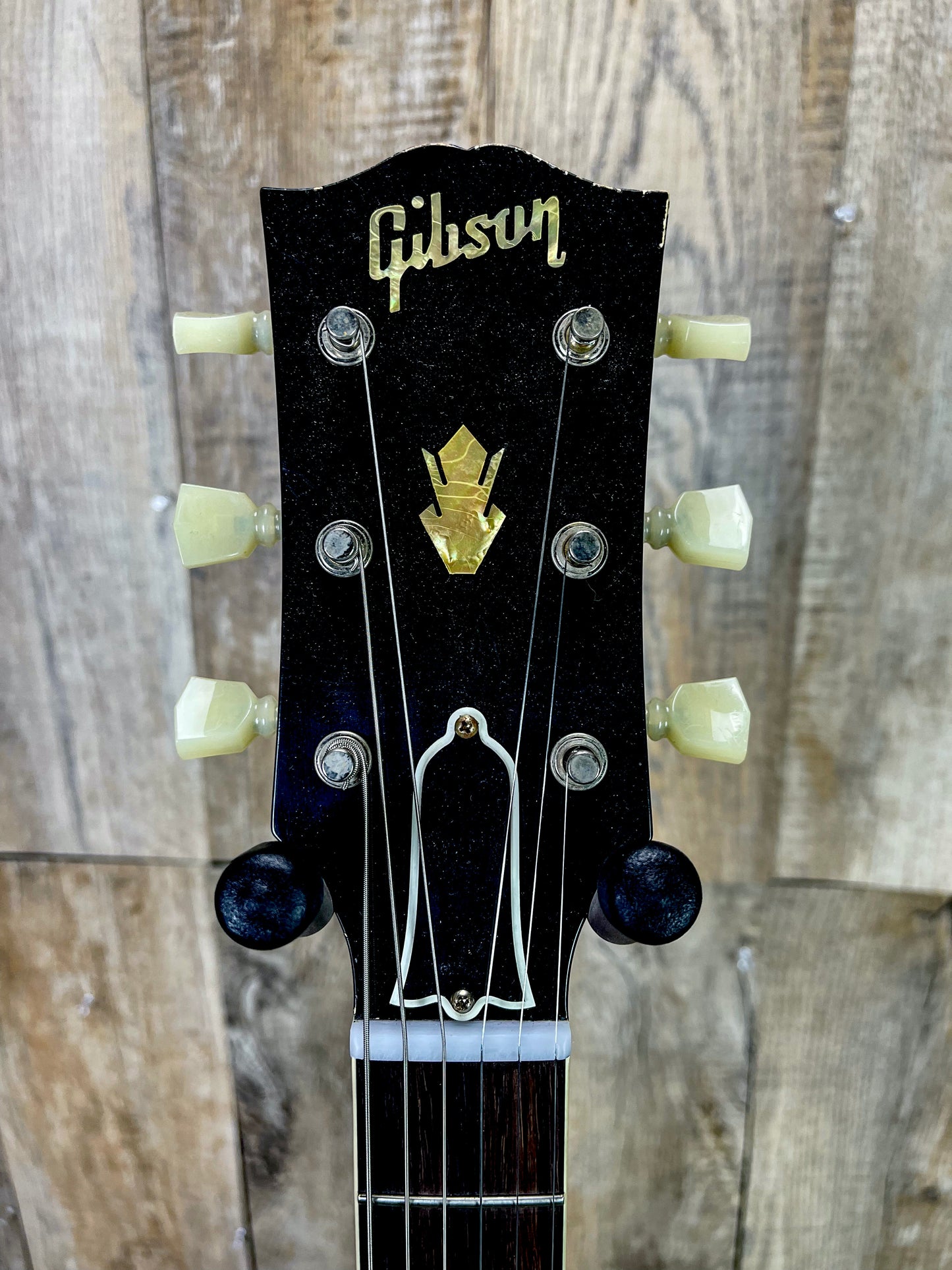 Close up of Gibson Custom Shop Murphy Lab 1964 SG Standard Reissue Pelham Blue w/ Maestro Light Aged headstock.