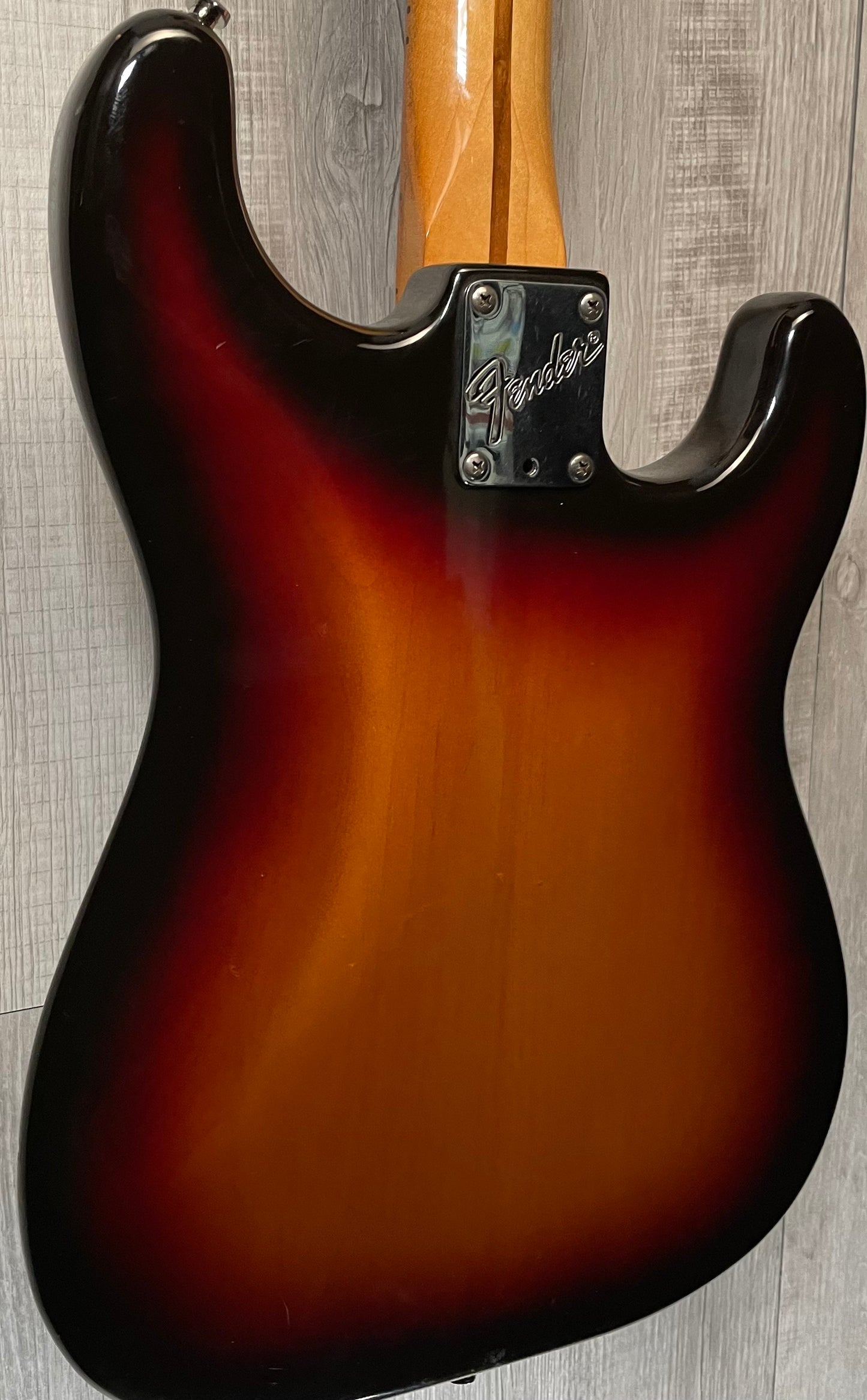 Back left angle of Used Vintage 1983 Fender Left Hand Stratocaster 3 Tone Sunburst TSS869.