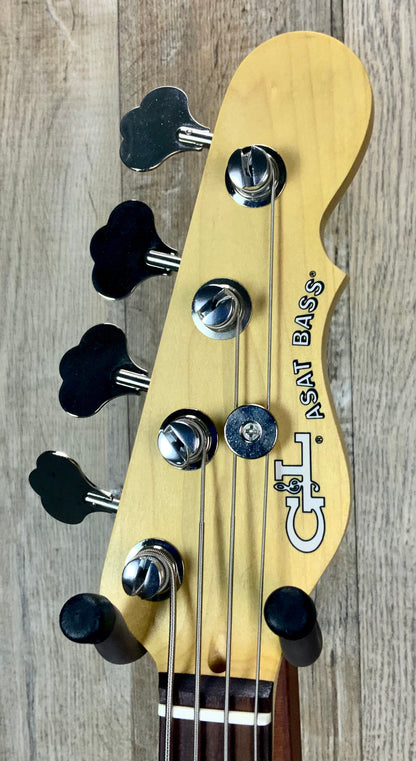 Close up of G&L USA ASAT Bass Honeyburst Ash RW headstock.