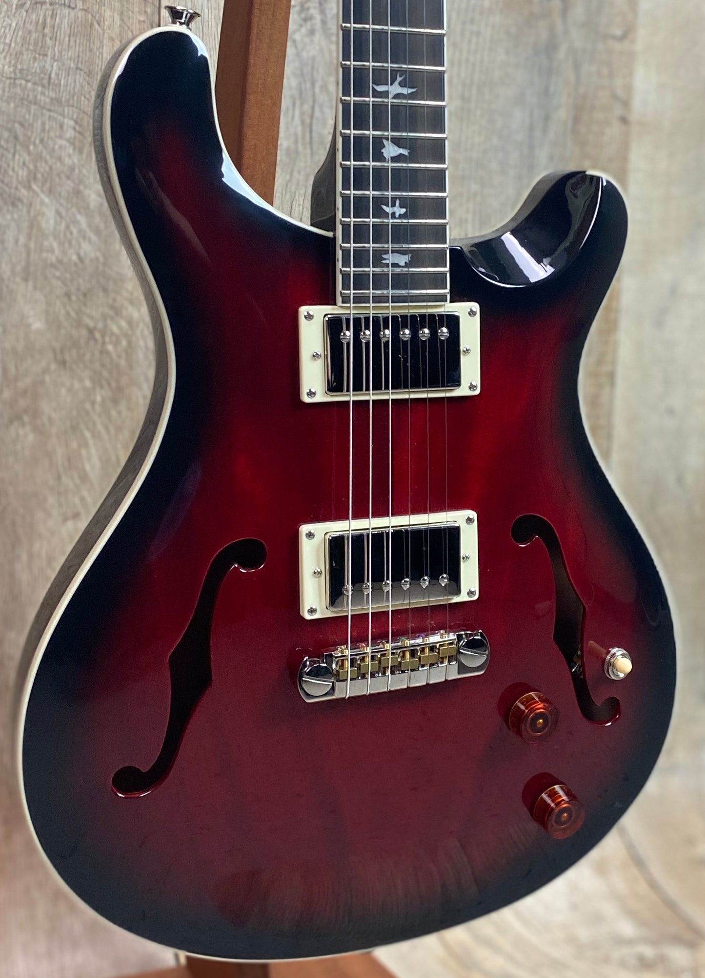 Front left angle of Open Box PRS Paul Reed Smith SE Hollowbody Standard Fire Red Burst.