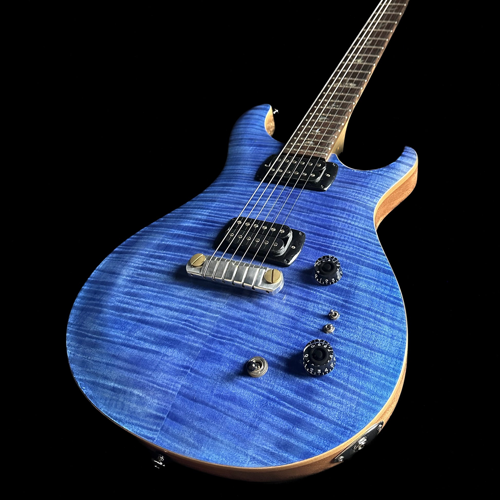 Bottom right angle of PRS Paul Reed Smith SE Paul's Guitar Faded Blue.