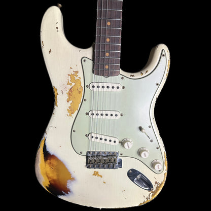 Front of Fender Custom Shop 1961 Stratocaster Heavy Relic Aged Vintage White/3-color Sunburst.