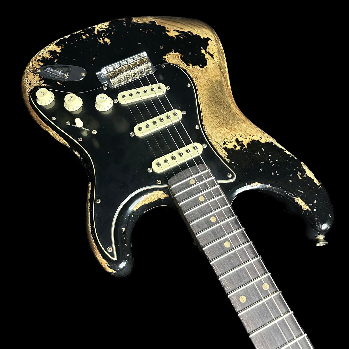 Upside down angle of Fender Custom Shop Limited Edition Poblano Stratocaster Super Heavy Relic Aged Black.
