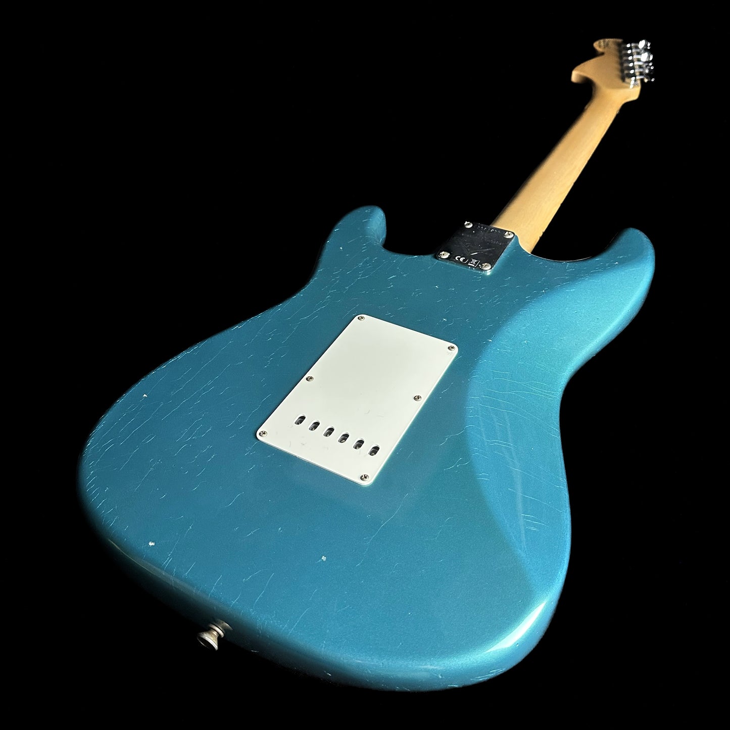 Back angle of Fender Custom Shop Limited Edition '68 Strat Journeyman Relic Aged Ocean Turquoise.