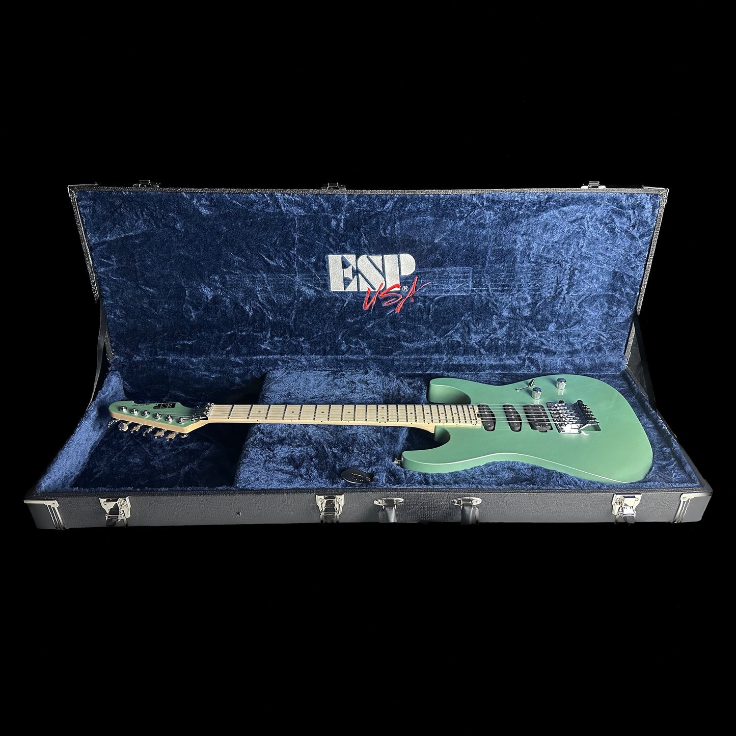 Left angle of ESP USA M-III Floyd Rose Oasis Green in case.