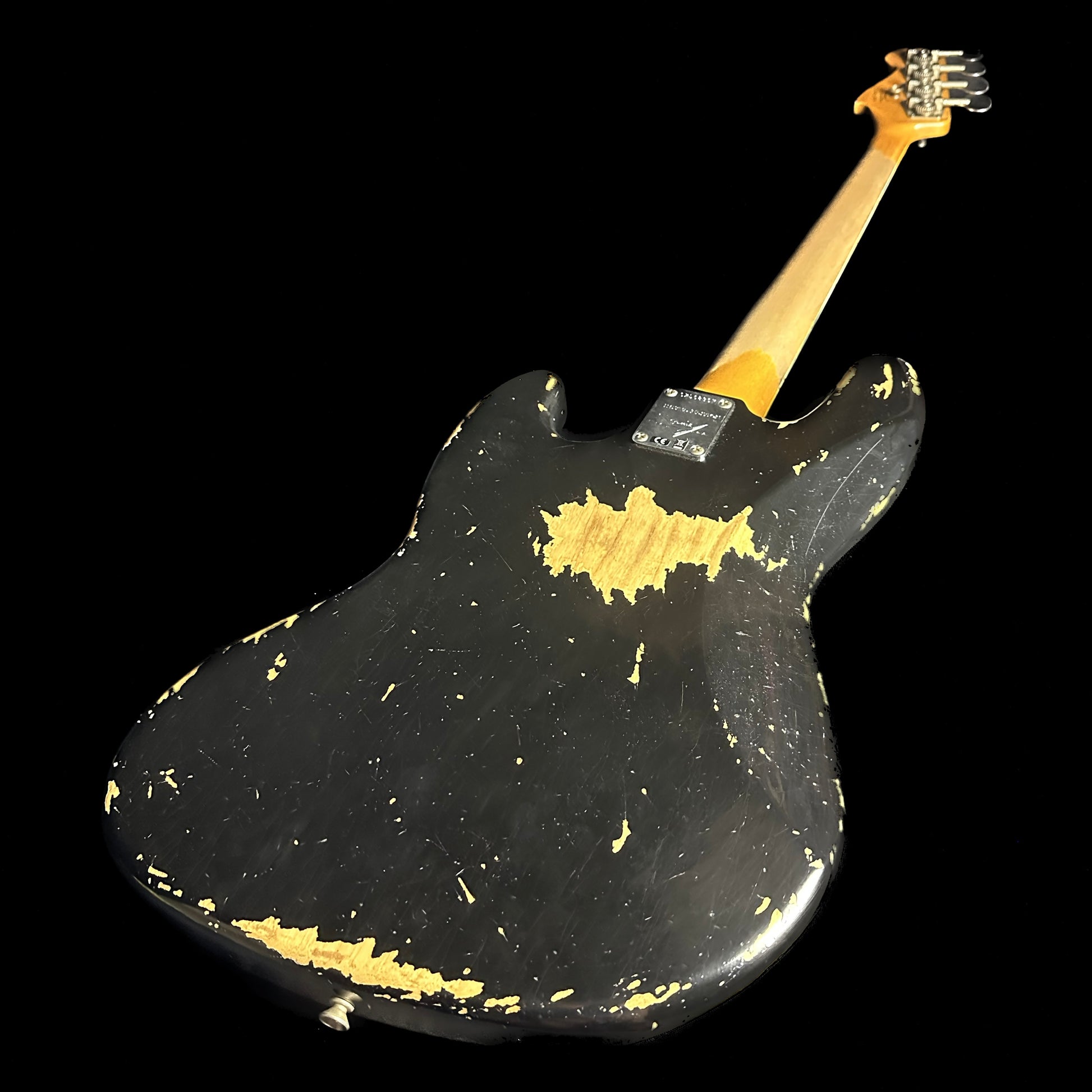 Back angle of Fender Custom Shop Limited Edition Custom Jazz Bass Heavy Relic Aged Black.