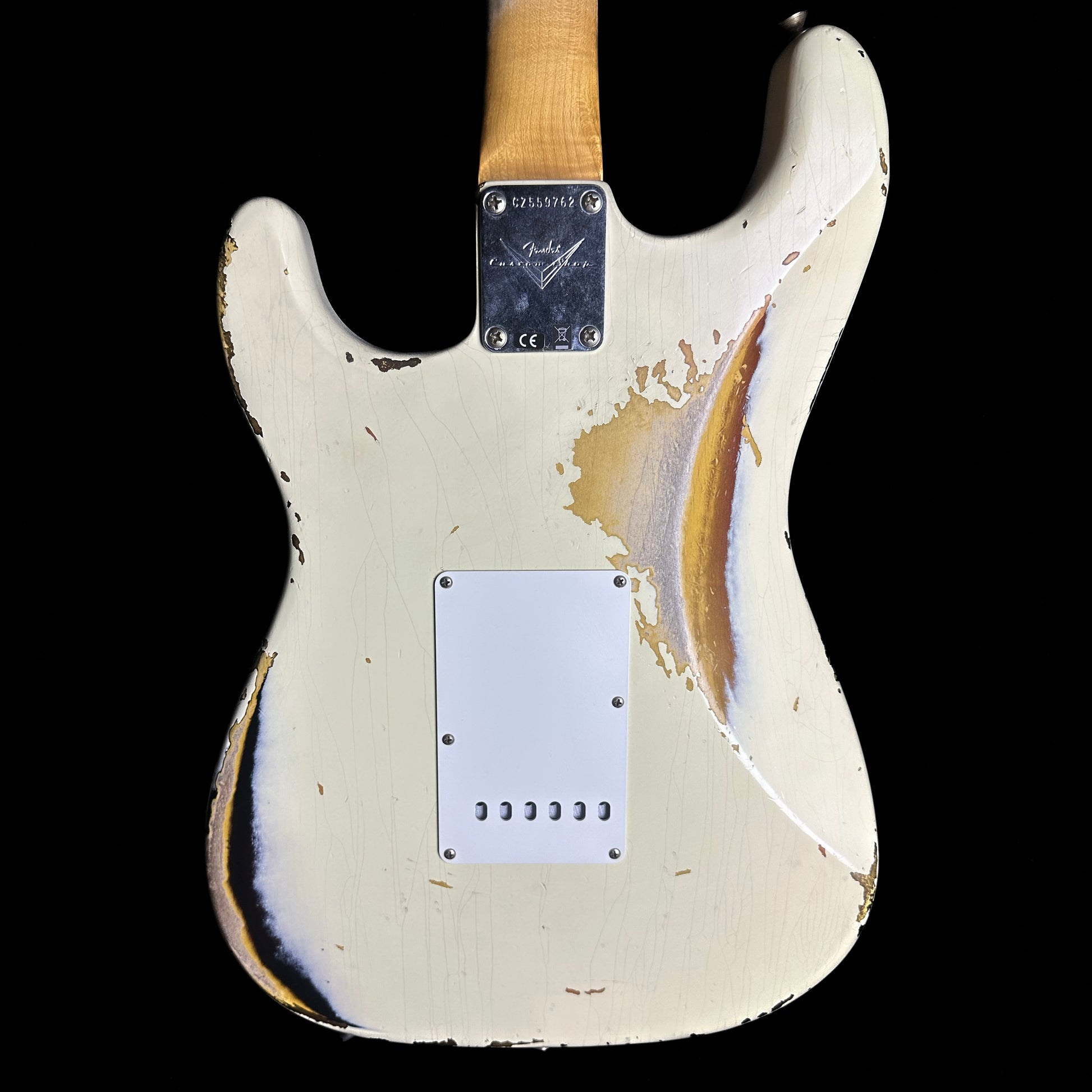 Back of Fender Custom Shop 1961 Stratocaster Heavy Relic Aged Vintage White/3-color Sunburst body.