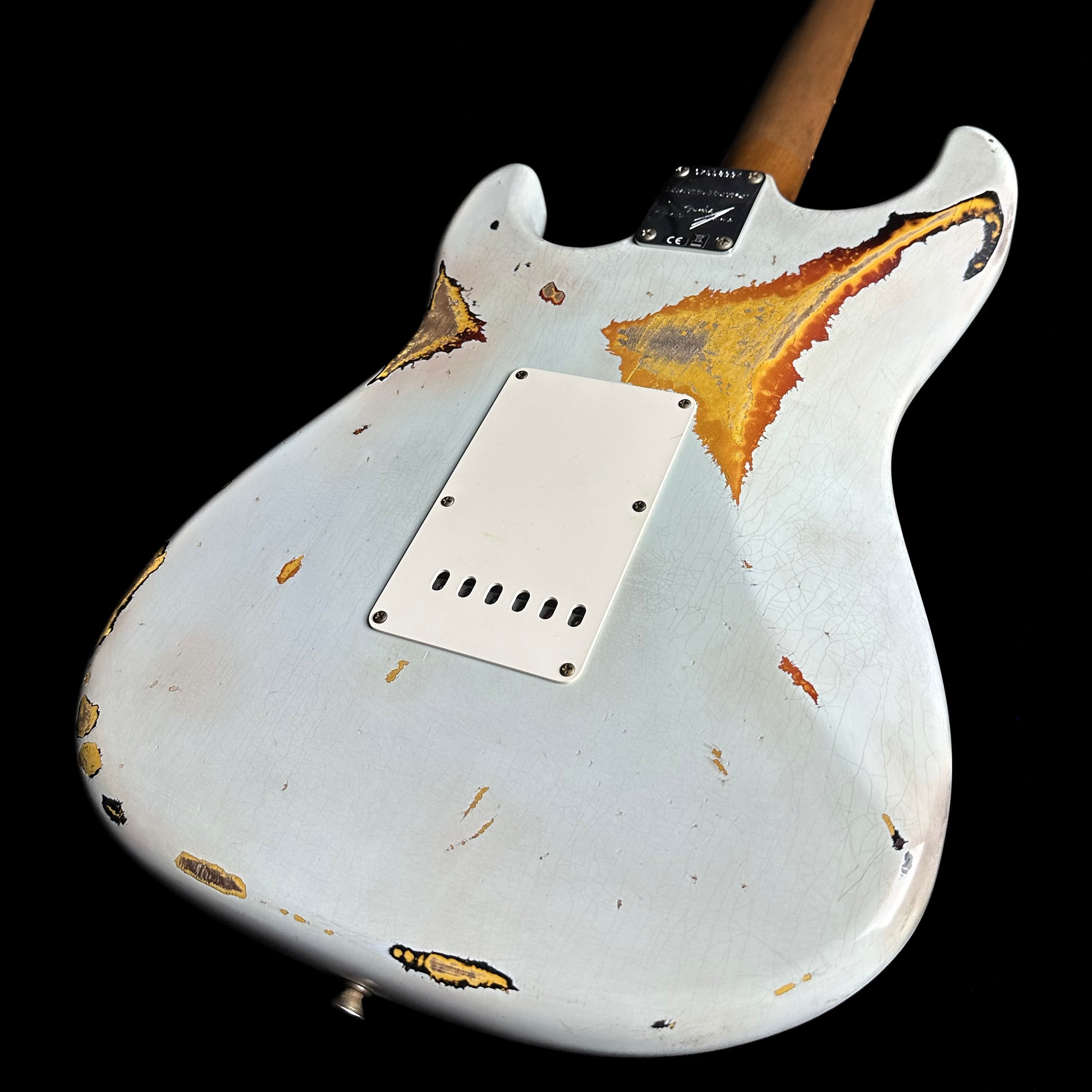 Bottom right angle of Fender Custom Shop Limited 61 Strat Heavy Relic Faded Aged Sonic Blue/3-Tone Sunburst back.