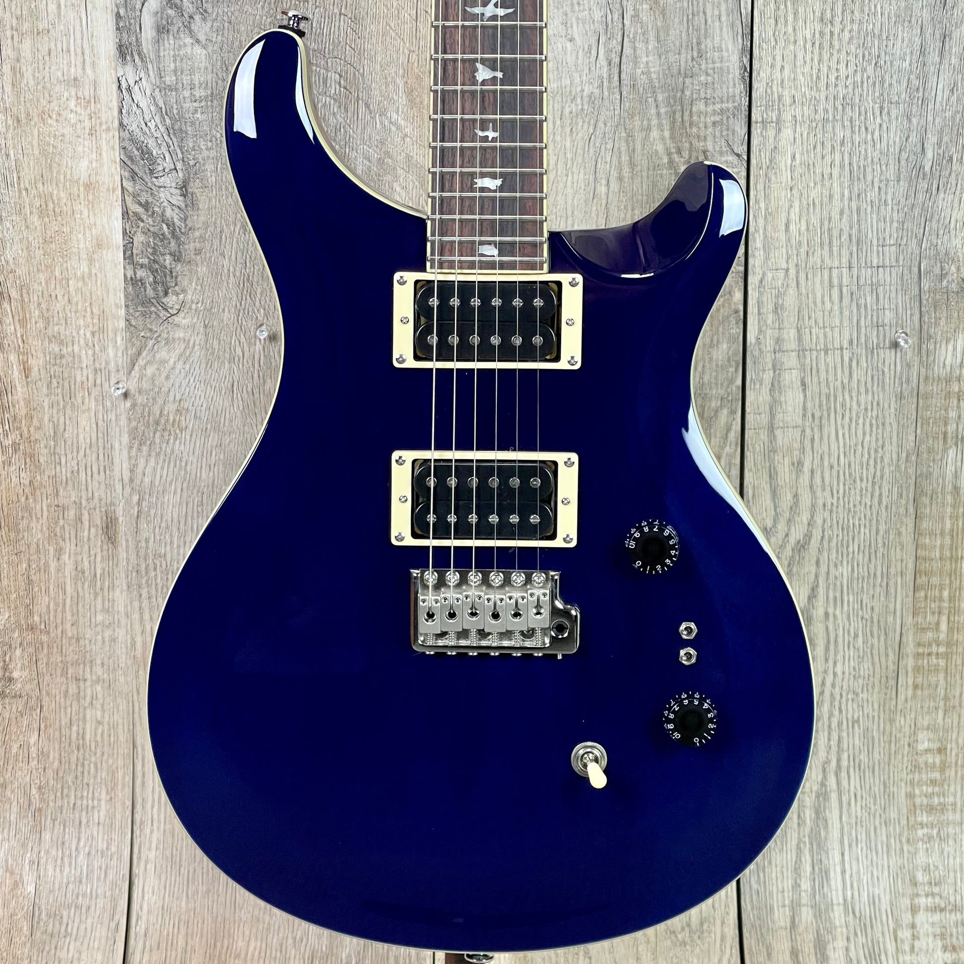 Front of PRS Paul Reed Smith SE Standard 24-08 Translucent Blue.
