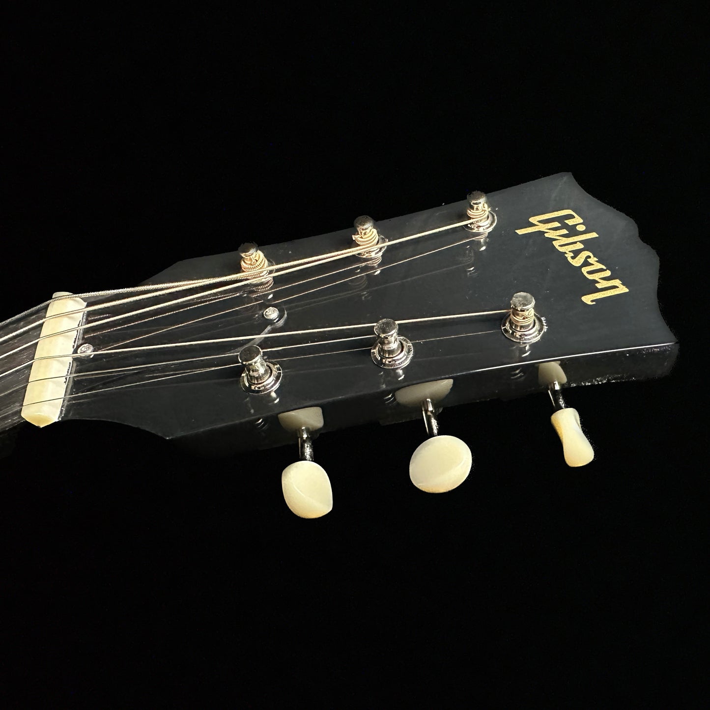 Close up of Gibson Custom Shop M2M 50's LG-2 Ebony headstock.