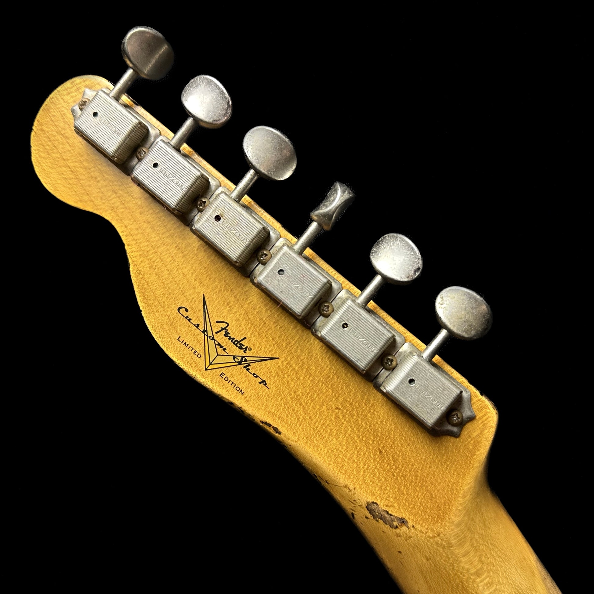 Back of headstock of Fender Custom Shop Limited 65 Telecaster Custom Heavy Relic MP Aged Tahitian Coral/3TSB.