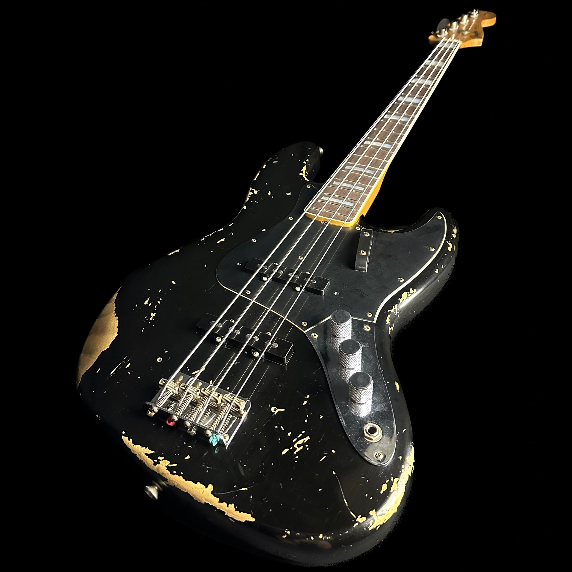 Front angle of Fender Custom Shop Limited Edition Custom Jazz Bass Heavy Relic Aged Black.