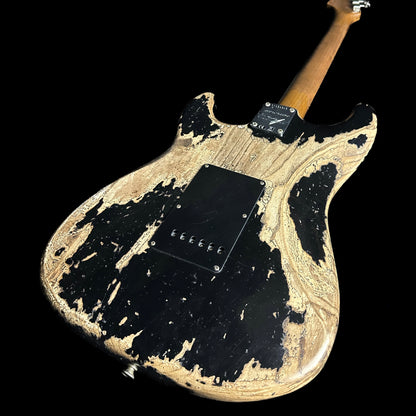 Back angle of Fender Custom Shop Limited Edition Poblano Stratocaster Super Heavy Relic Aged Black.
