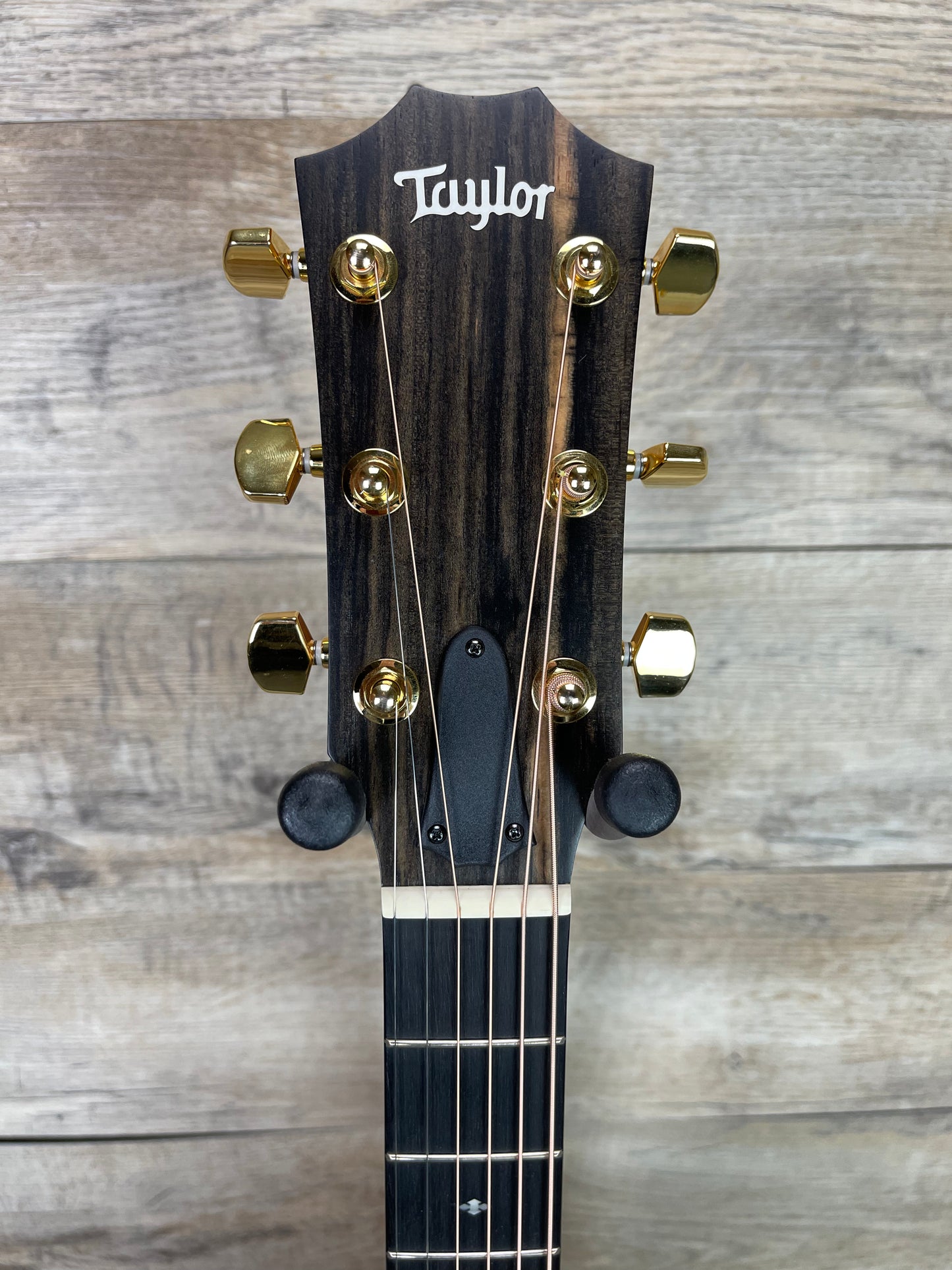 Close up of Taylor 224ce-K DLX Shaded Edgeburst Left Hand headstock.