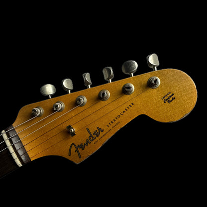 Close up of Fender Custom Shop 1961 Stratocaster Heavy Relic Aged Vintage White/3-color Sunburst headstock.