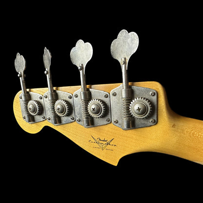 Back of headstock of Fender Custom Shop Limited Edition '59 Precision Bass Journeyman Relic HLE Gold.