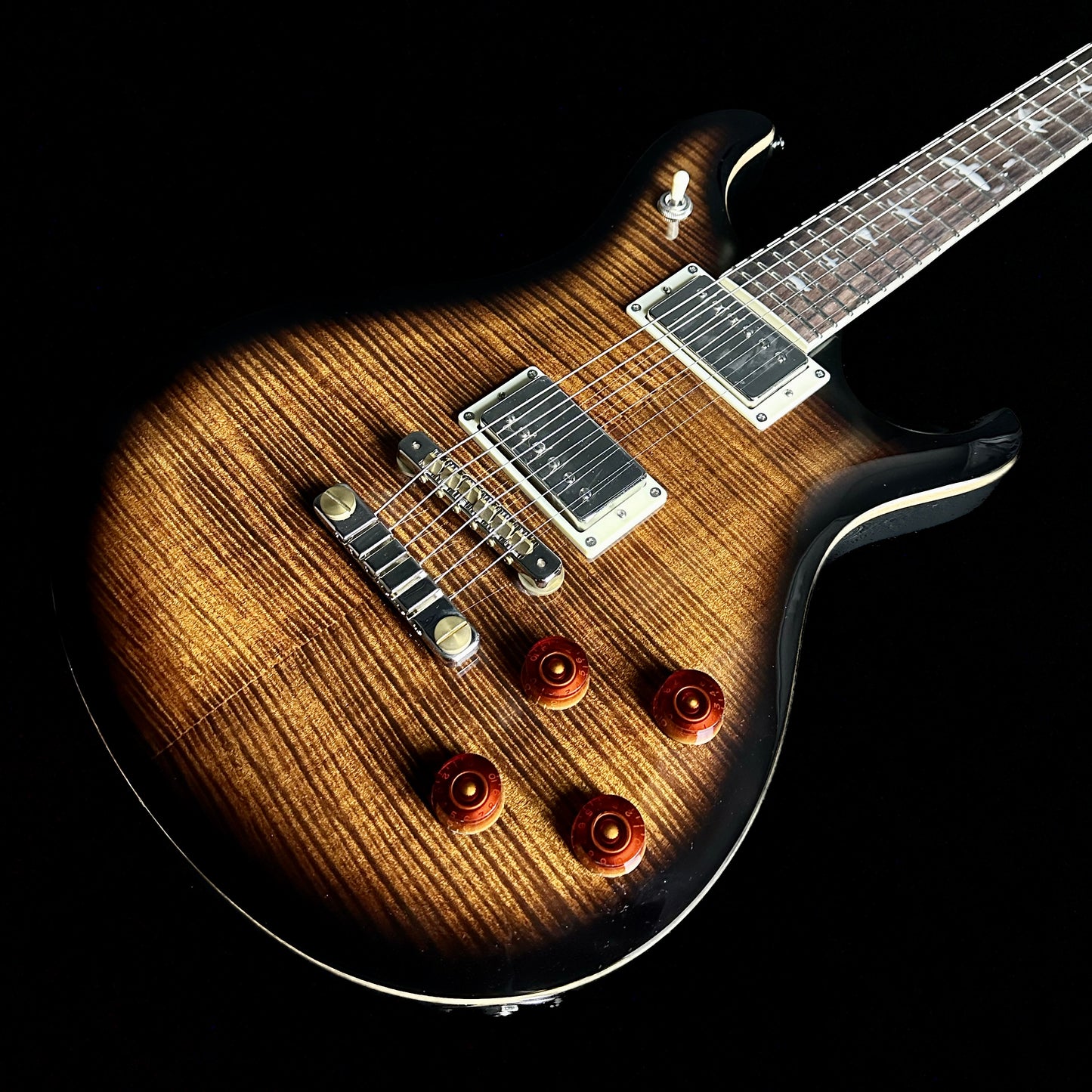 Front angle of PRS Paul Reed Smith SE McCarty 594 Black Gold Sunburst.