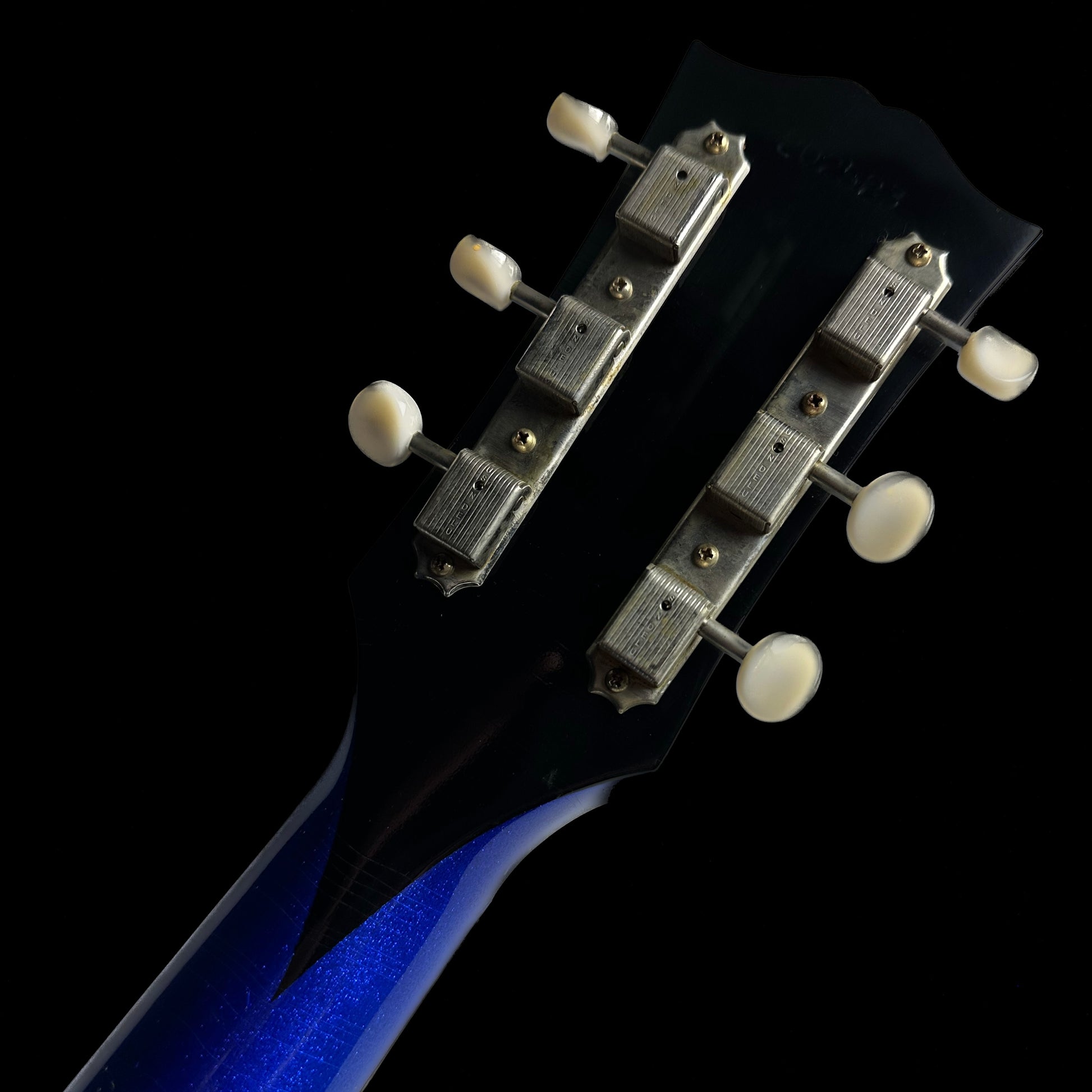 Back of Gibson Custom Shop M2M 63 SG Junior Blue Sparkle w/Stinger Short Maestro Murphy Lab Ultra Light Aged headstock.