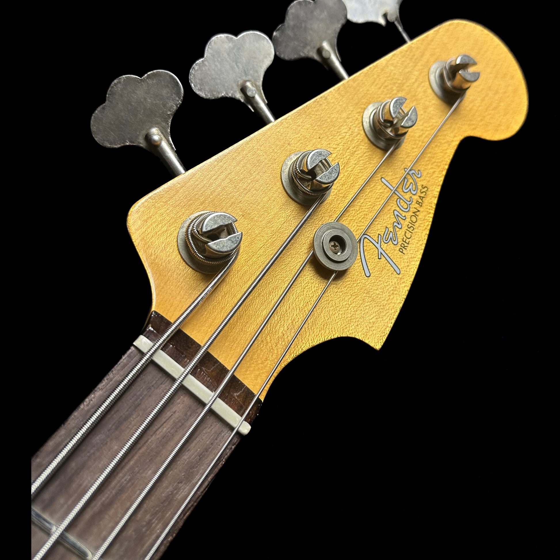 Headstock of Fender Custom Shop Limited Edition '59 Precision Bass Journeyman Relic HLE Gold.