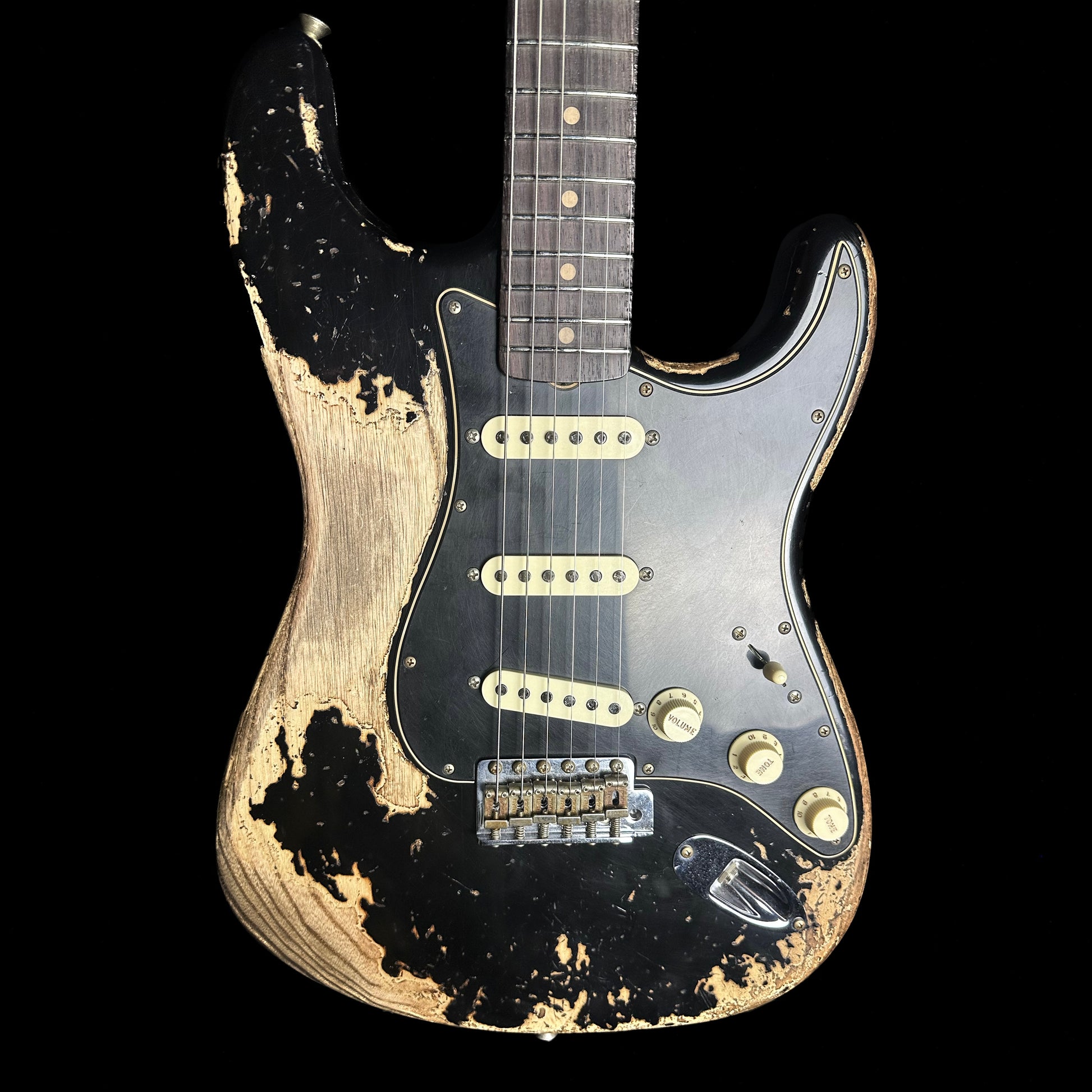 Front of Fender Custom Shop Limited Edition Poblano Stratocaster Super Heavy Relic Aged Black.