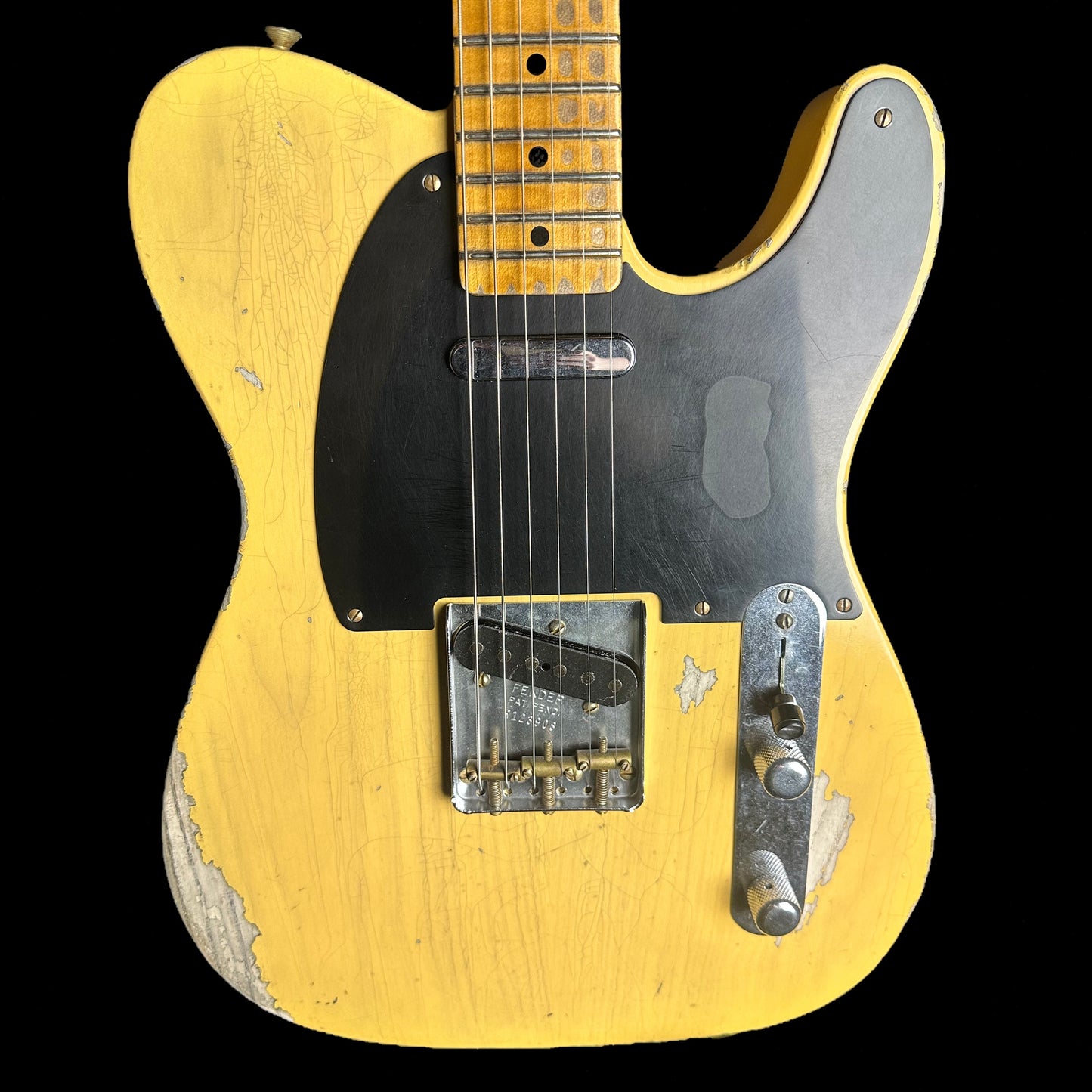 Front of Fender Custom Shop '52 Telecaster Heavy Relic Maple Neck Aged Nocaster Blonde.