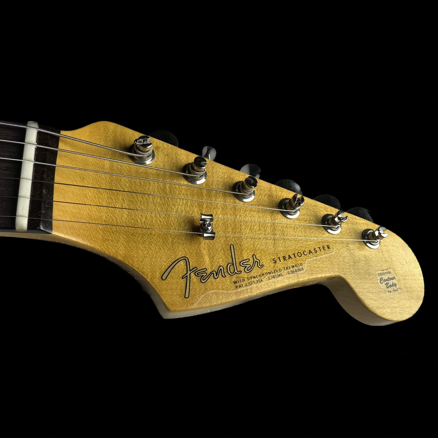 Headstock of Fender Custom Shop Limited Edition 1964 Stratocaster Journeyman Relic Faded Aged Shell Pink.