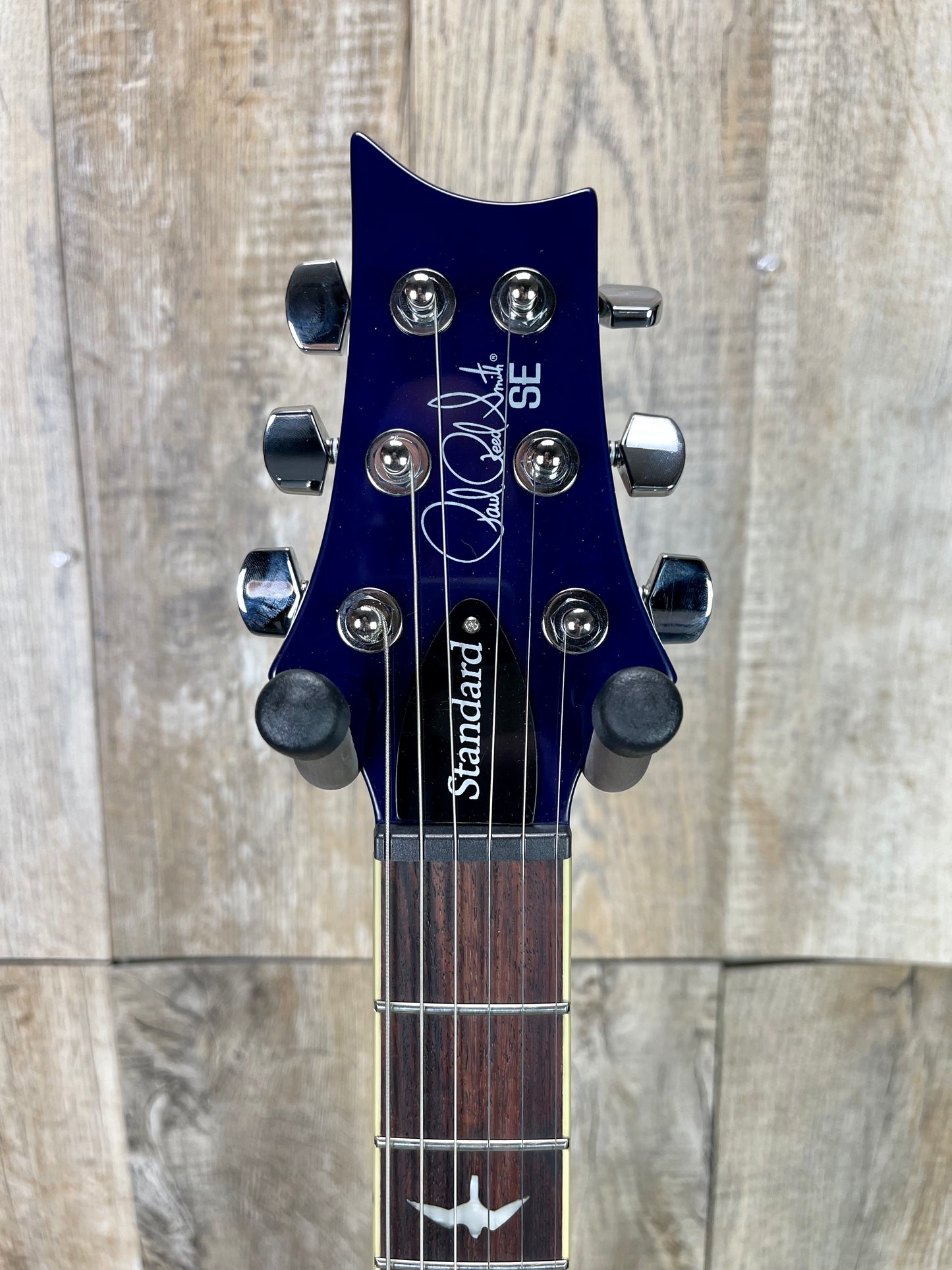 Close up of PRS Paul Reed Smith SE Standard 24-08 Translucent Blue headstock.