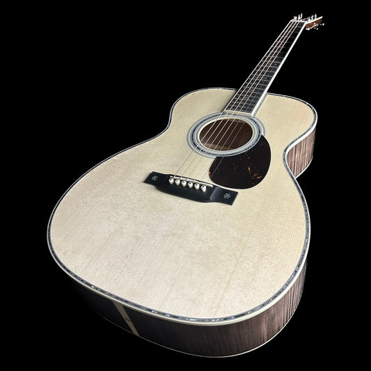 Front angle of Martin Custom Shop 42 Style OM Adirondack/Pacific Big Leaf Flamed Maple.