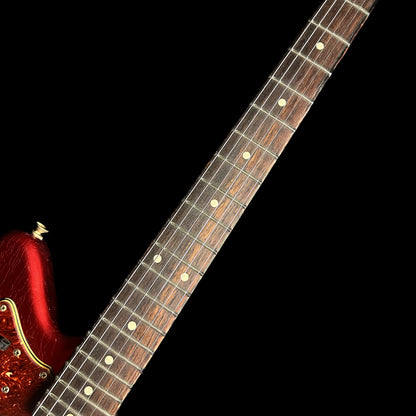 Closeup of Fender Custom Shop 1962 Jazzmaster Journeyman Relic Aged Candy Apple Red Reverse Headstock fretboard.