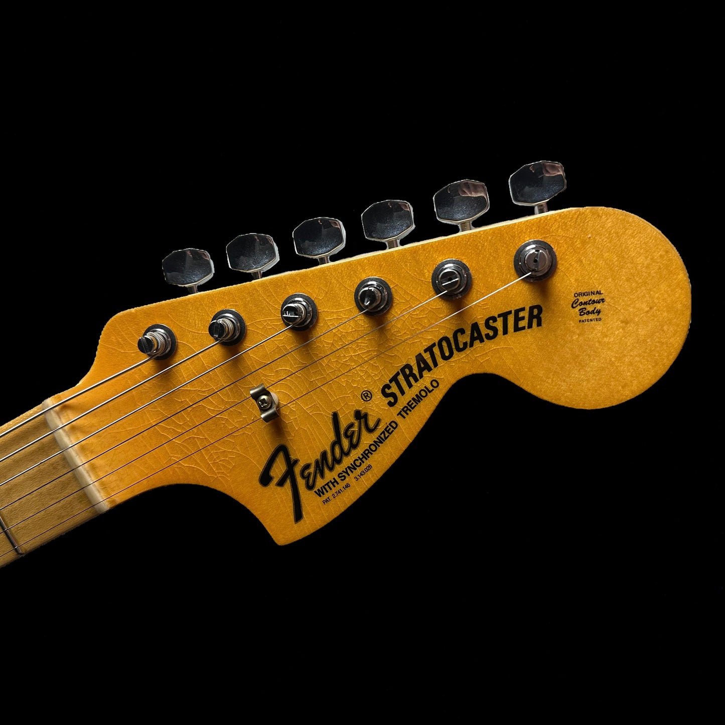 Headstock of Fender Custom Shop Limited Edition '69 Strat Journeyman Relic Aged Candy Tangerine.