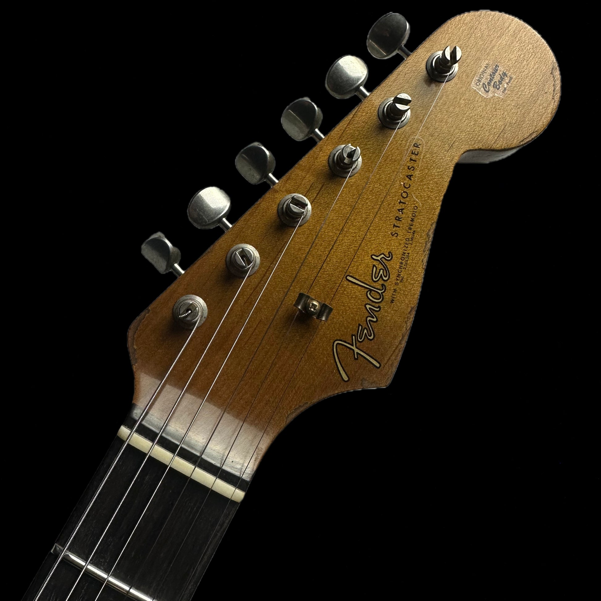 Headstock of Fender Custom Shop Limited Edition Poblano Stratocaster Super Heavy Relic Aged Black.