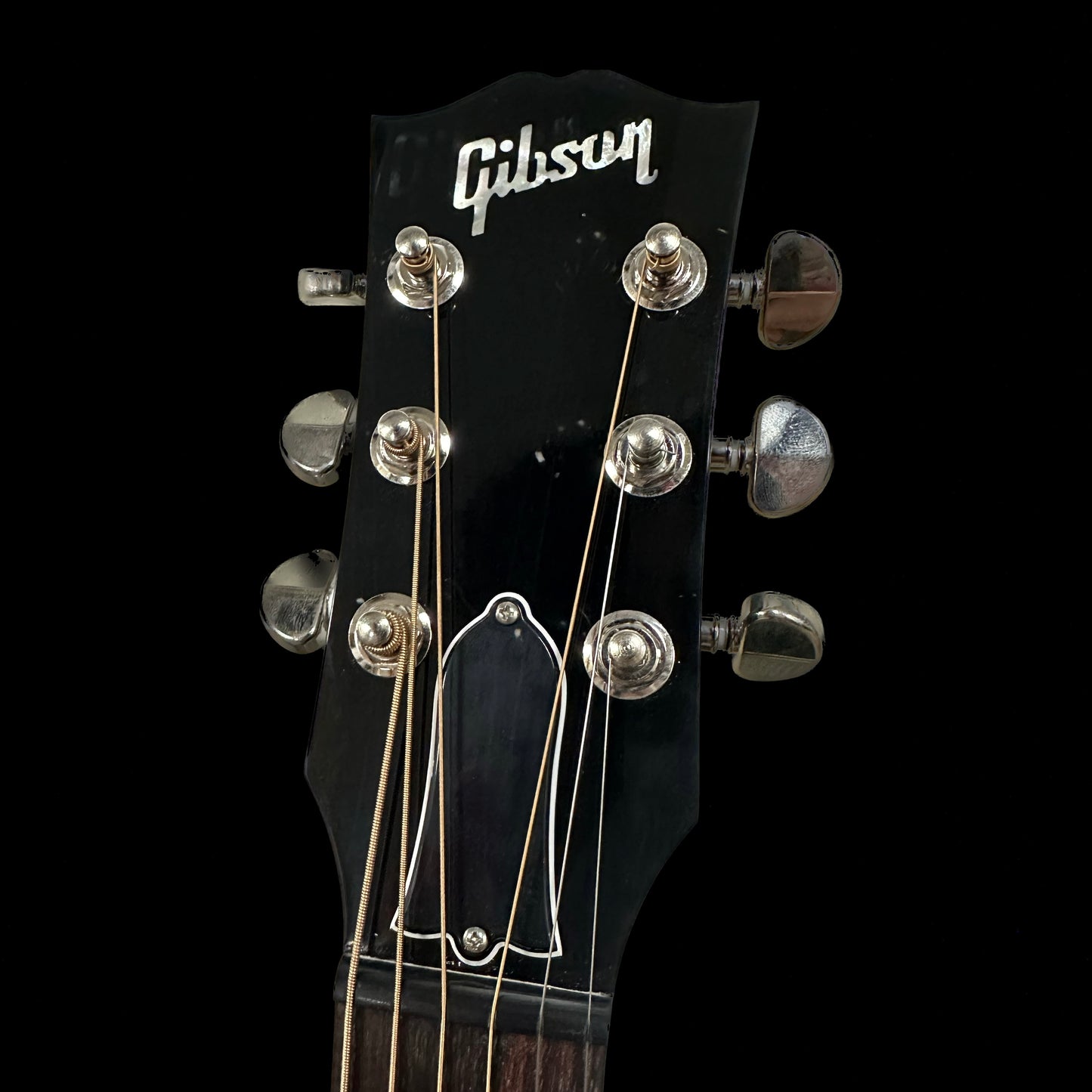 Close up of Gibson Custom Shop M2M J-45 Long Scale Ebony headstock.