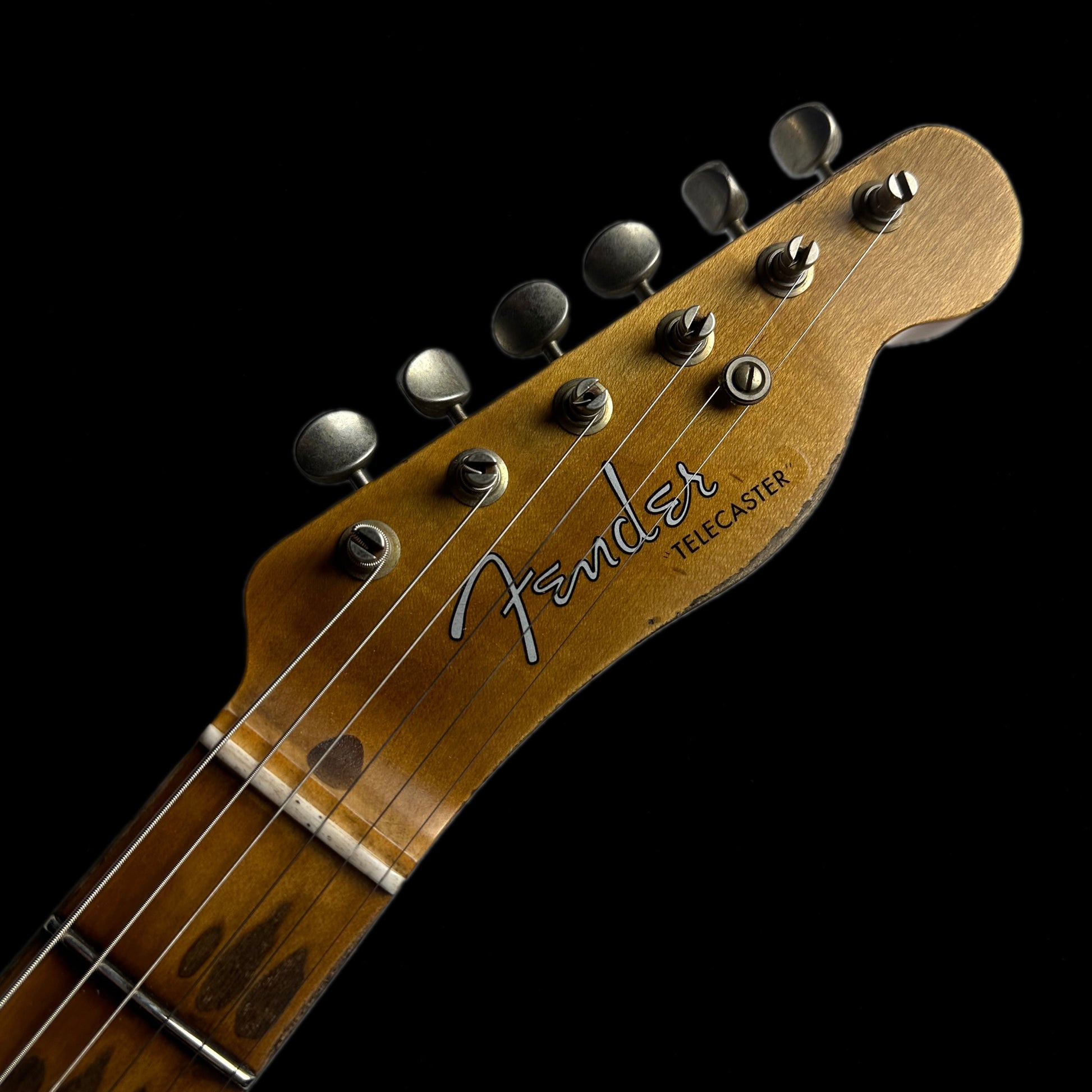 Closeup of Fender Custom Shop '52 Telecaster Heavy Relic Maple Neck Aged Nocaster Blonde headstock.